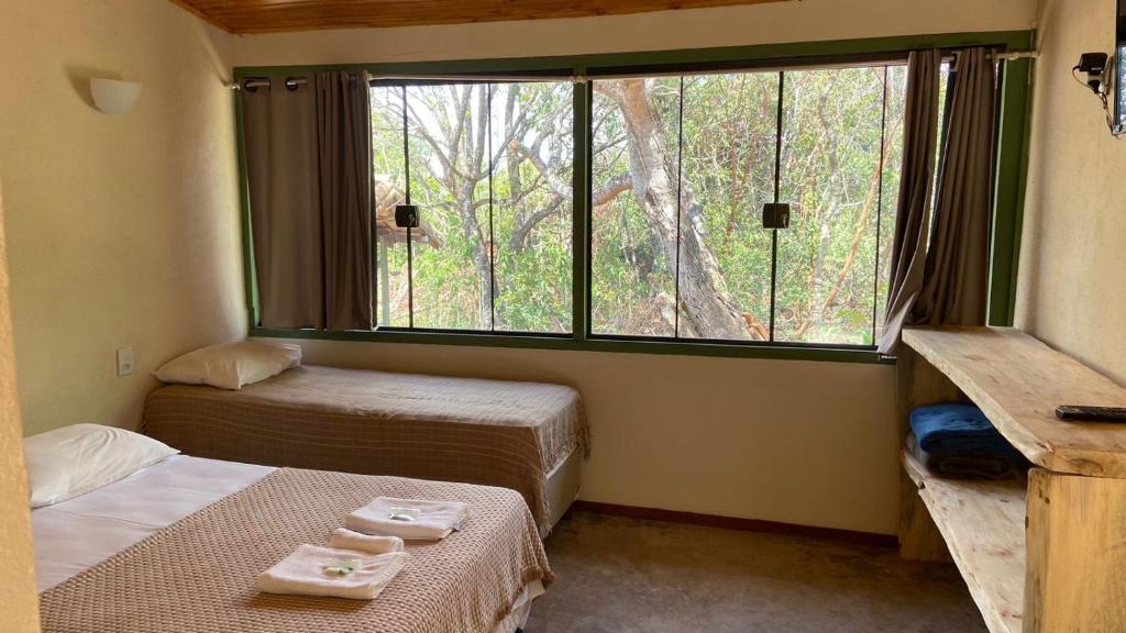 Postel nebo postele na pokoji v ubytování Pousada Serra Verde - Pousada Rural em Capitólio MG