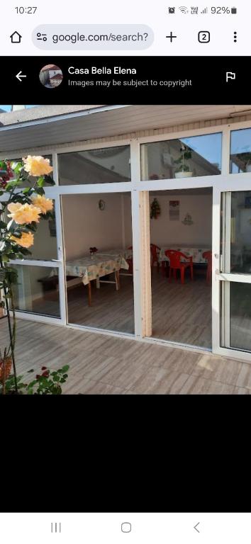 a page of a house with a view of a patio at Casa BELLA ELENA in Văleni