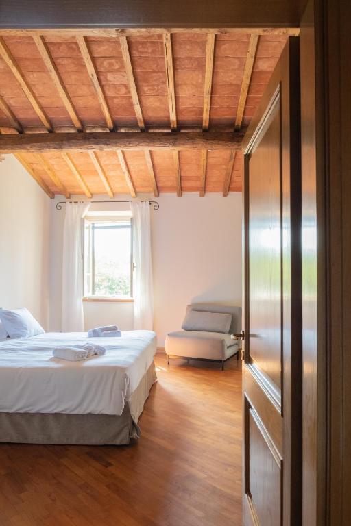 Postel nebo postele na pokoji v ubytování Podere Fignano, holiday home - apartments fully renovated 2024