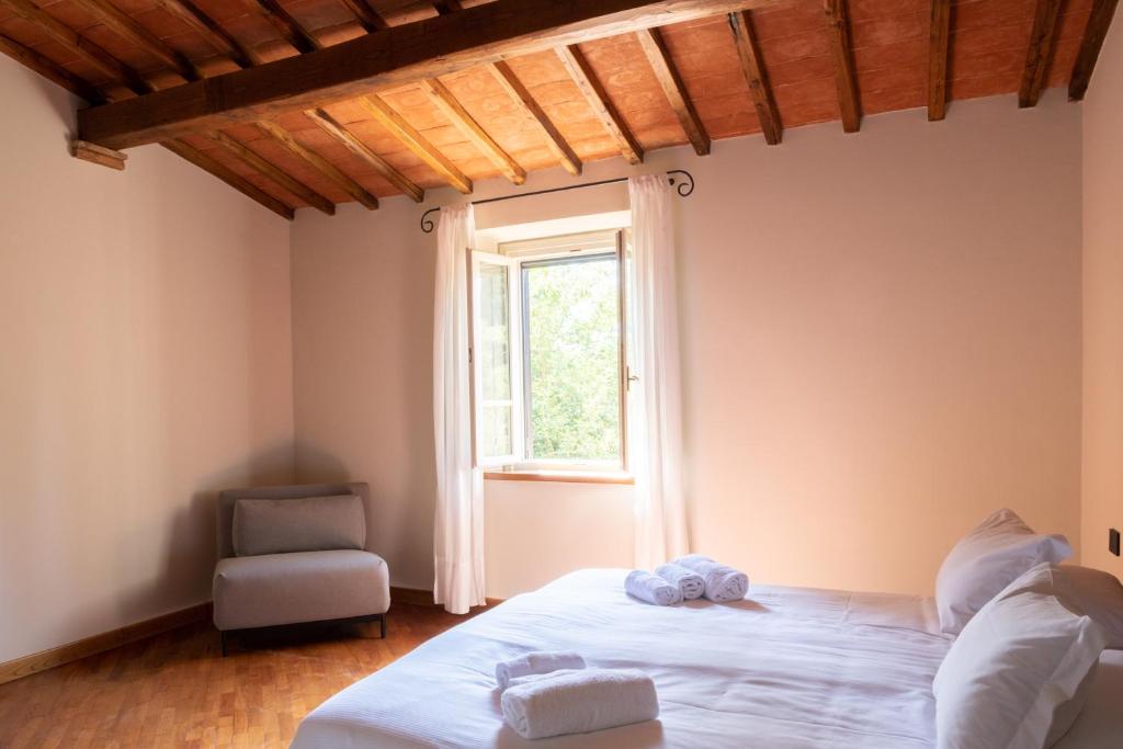 Postel nebo postele na pokoji v ubytování Podere Fignano, holiday home - apartments fully renovated 2024