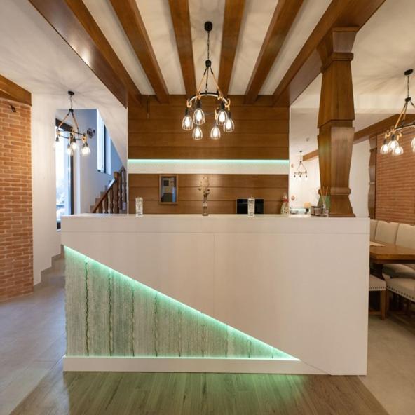 a kitchen with a white counter in a room at Casa Danciu in Fînaţe