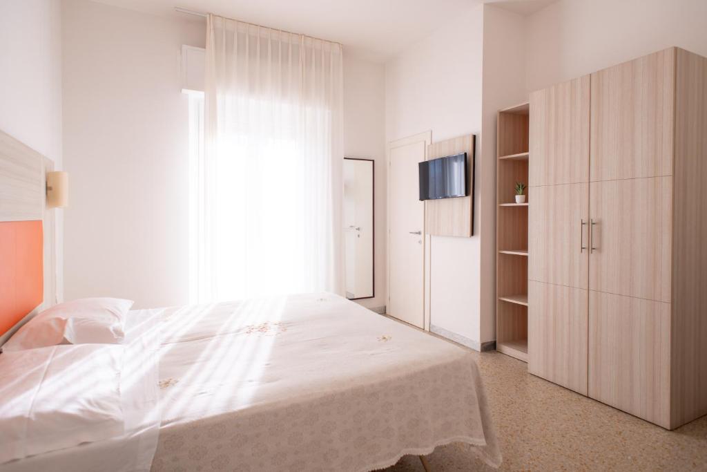 Postel nebo postele na pokoji v ubytování Hotel Silver
