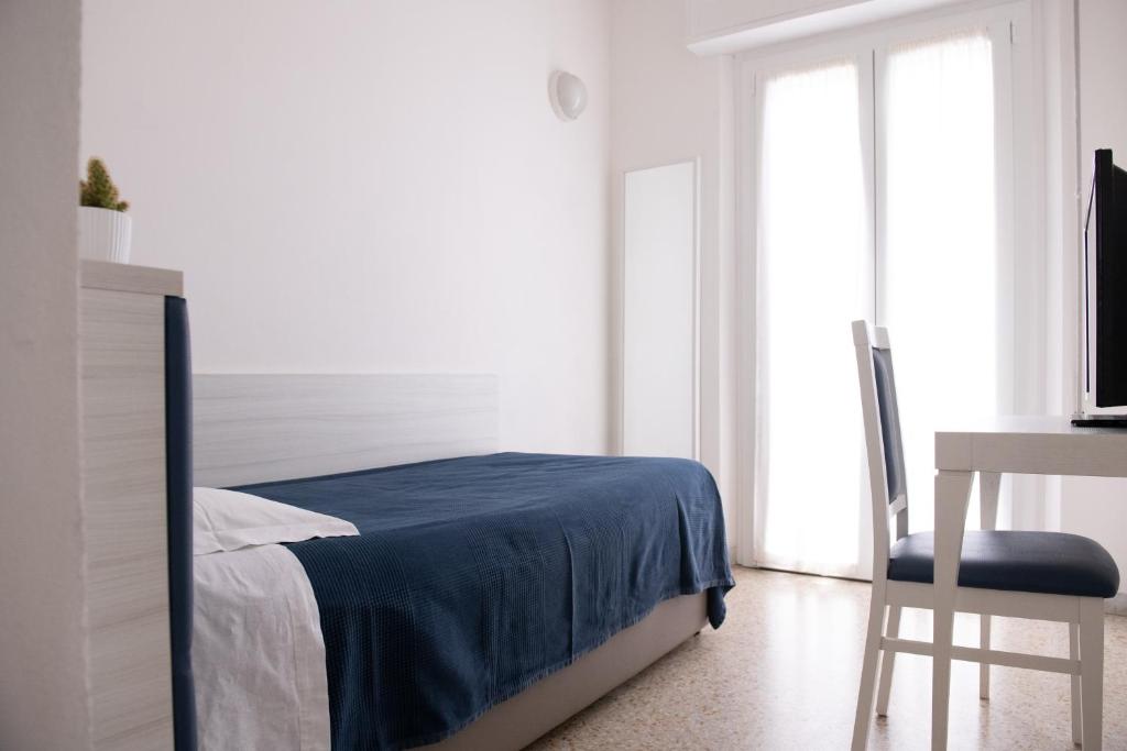 Postel nebo postele na pokoji v ubytování Hotel Silver
