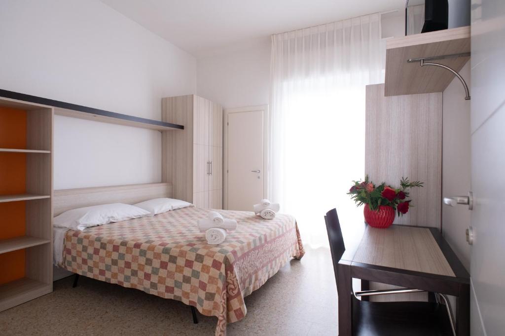 Postel nebo postele na pokoji v ubytování Hotel Silver