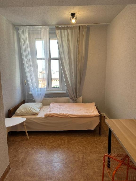 Łóżko lub łóżka w pokoju w obiekcie Hostel J17