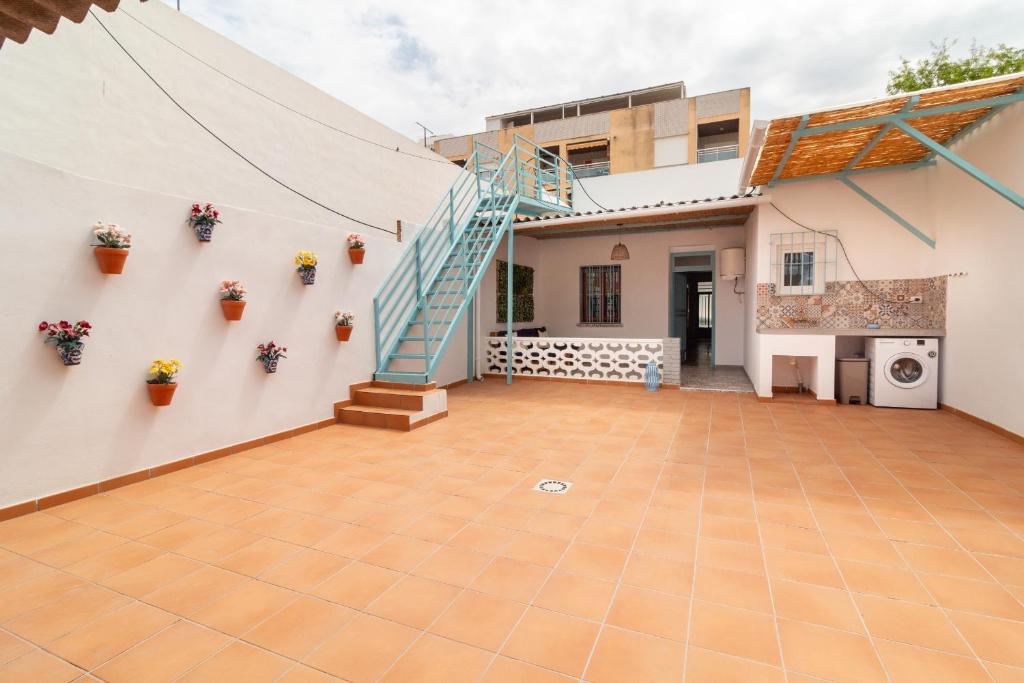 a view of the courtyard of a house with a staircase at Global Properties, Les Villetes - Magdalena in Moncófar