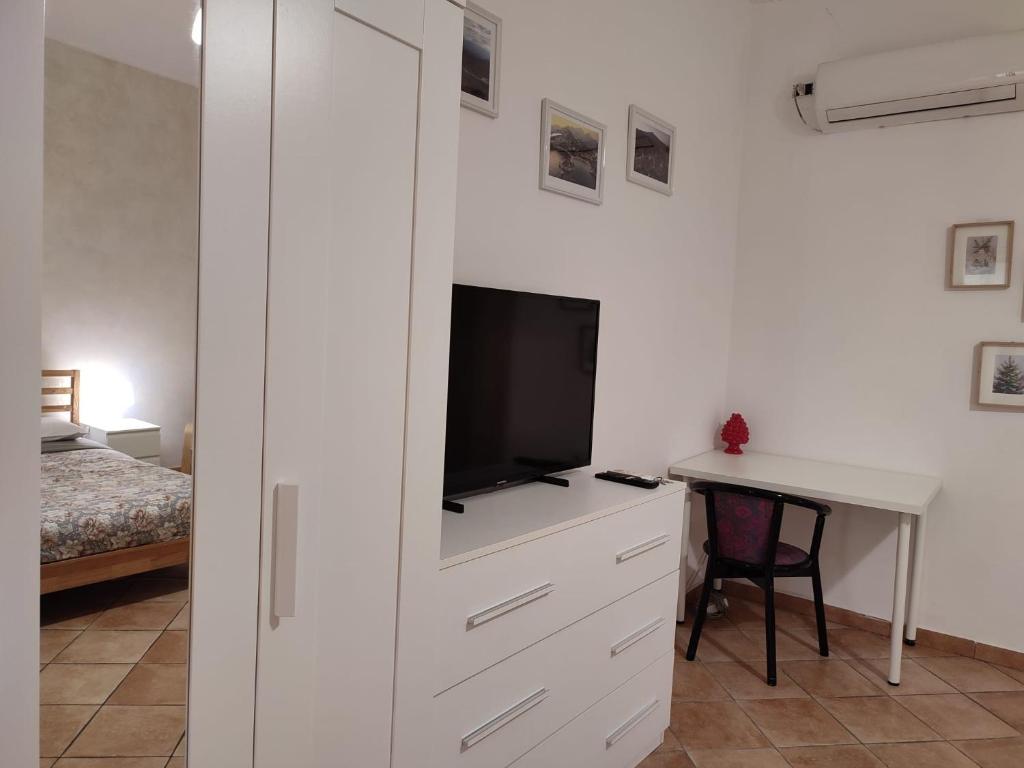 A bed or beds in a room at Appartamento Aci Sant'Antonio