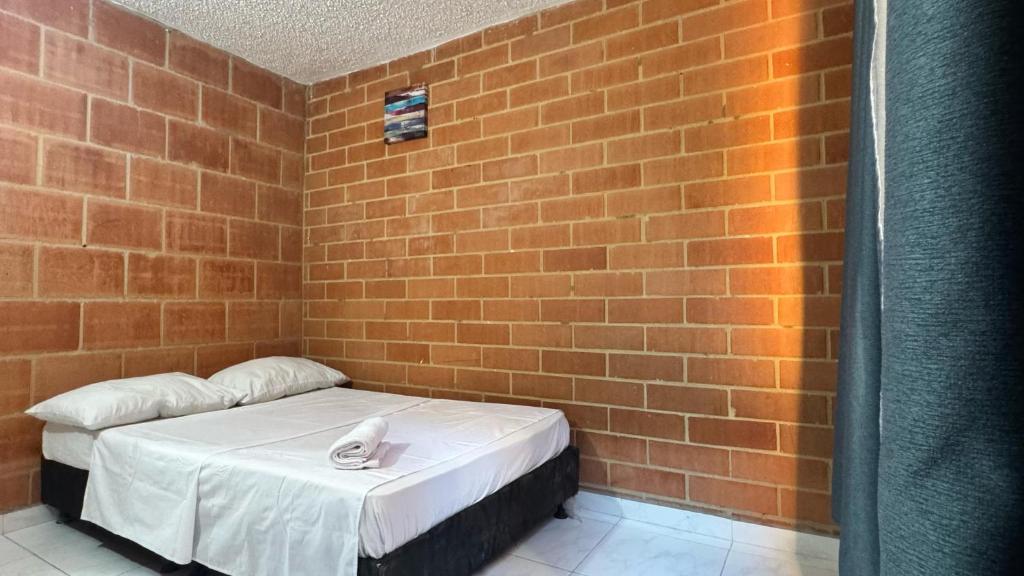 Ένα ή περισσότερα κρεβάτια σε δωμάτιο στο Habitacion Brisas Ricaurte