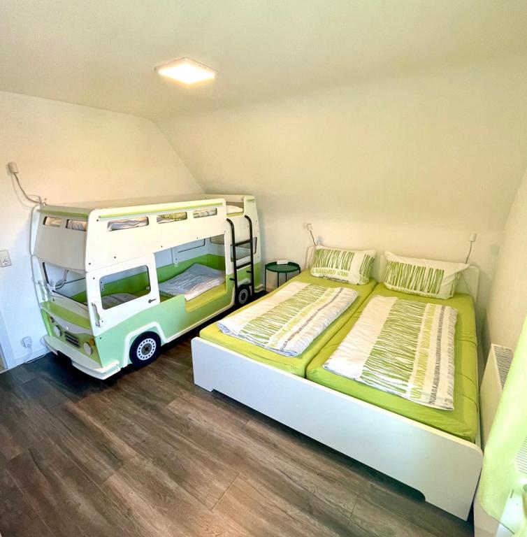 a room with two beds and a van in it at Ferienwohnung Seehas am Bodensee in Friedrichshafen