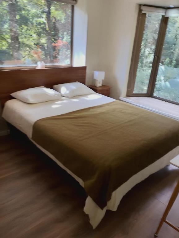 Postel nebo postele na pokoji v ubytování Condominio Nuevo Parque Suizo