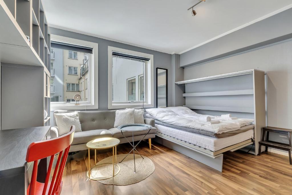 En eller flere senge i et værelse på Cozy Studio Retreat