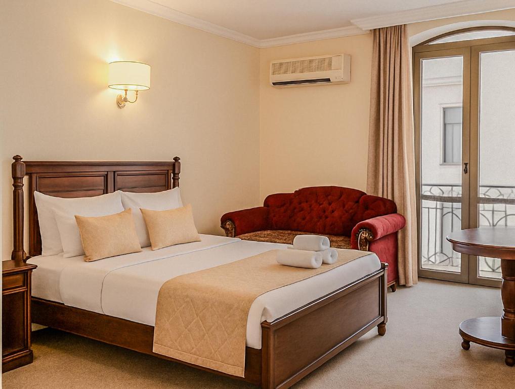 Postel nebo postele na pokoji v ubytování Ritsa Boutique Hotel