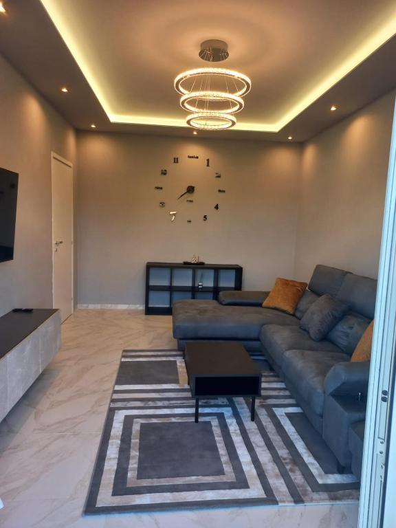 a living room with a couch and a table at Luxury Home in Volta Mantovana