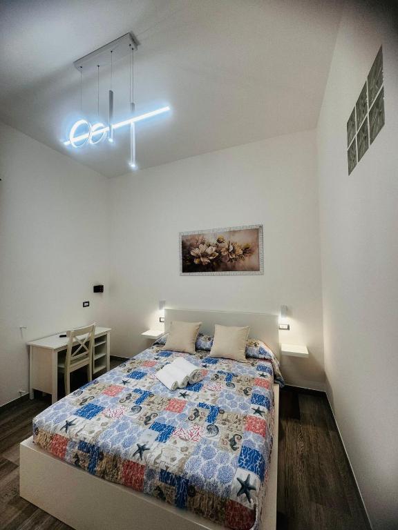 Postel nebo postele na pokoji v ubytování Conte Cavour B&B