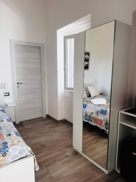 Postel nebo postele na pokoji v ubytování Conte Cavour B&B