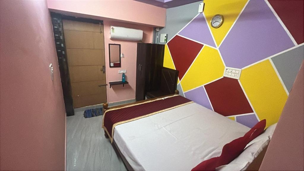 Postel nebo postele na pokoji v ubytování PANMOZHI RESIDENCY