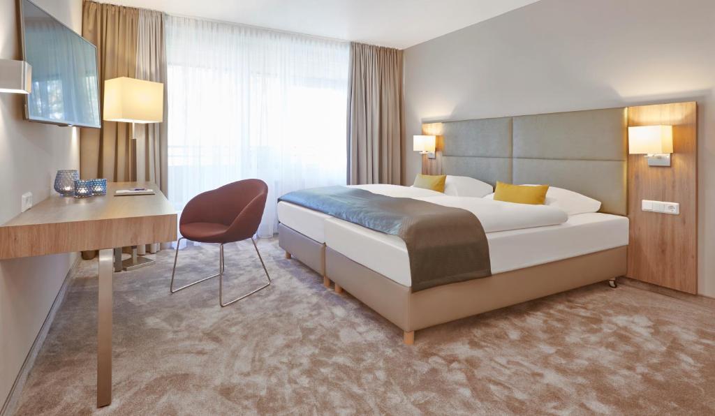 Postel nebo postele na pokoji v ubytování Upstalsboom Parkhotel