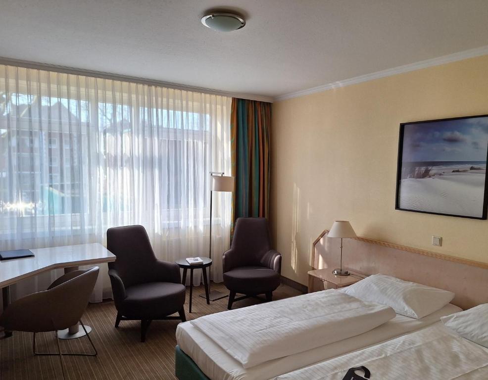 Postel nebo postele na pokoji v ubytování Upstalsboom Parkhotel