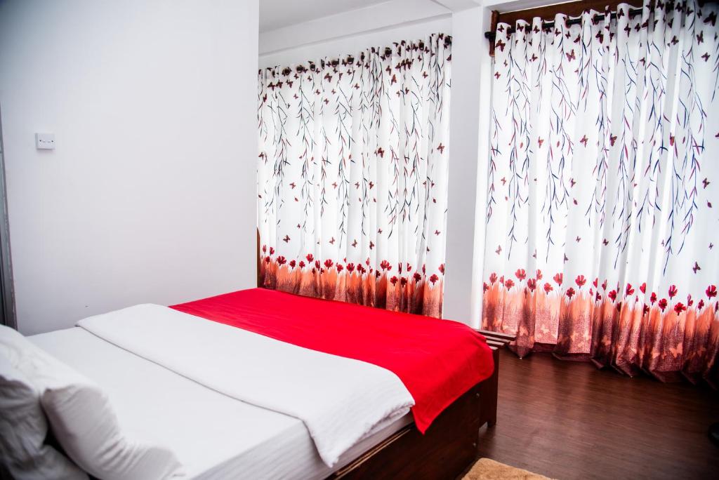 Postel nebo postele na pokoji v ubytování Minthu Homestay