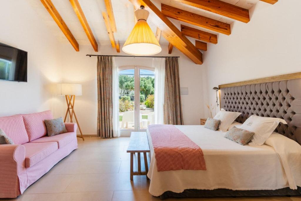 Postel nebo postele na pokoji v ubytování Hotel Rural Binigaus Vell