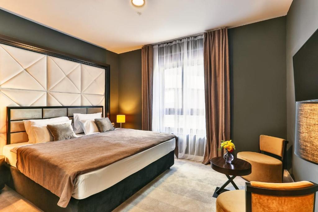 Postel nebo postele na pokoji v ubytování Maresia Boutique Suites