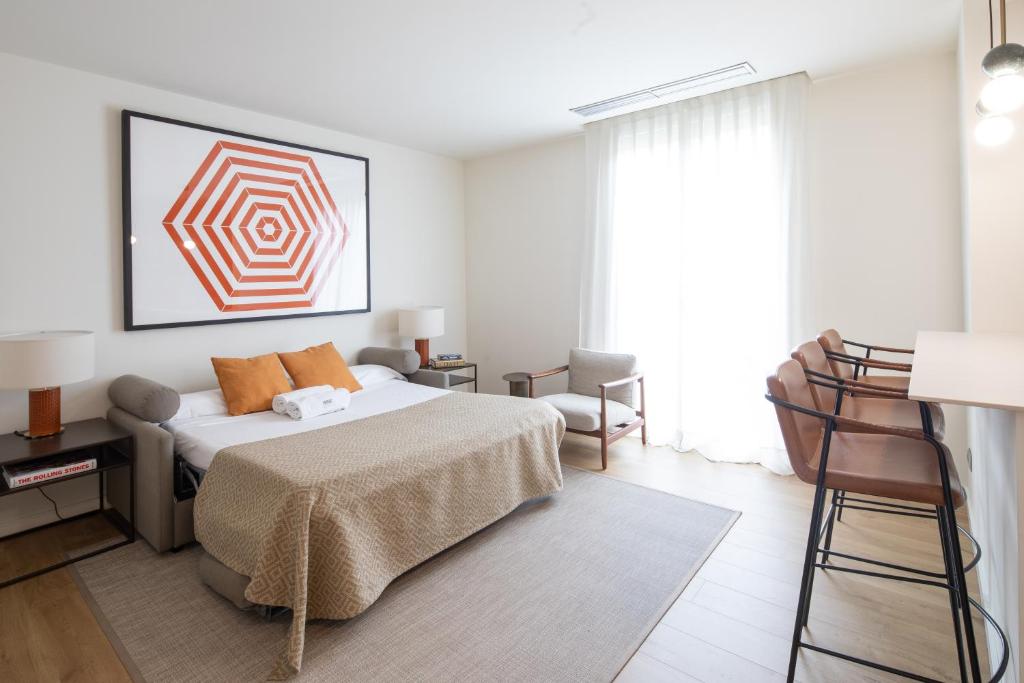 Posteľ alebo postele v izbe v ubytovaní Murmuri Residence Concepció