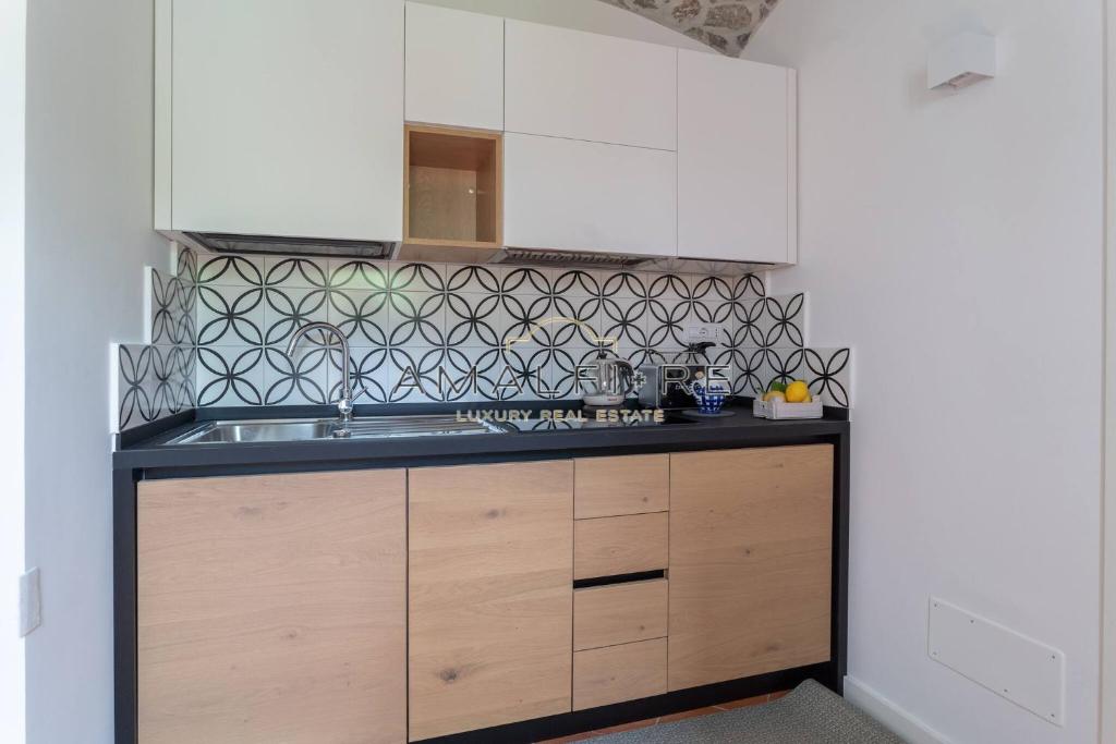 Кухня или мини-кухня в Lionetti Suite House
