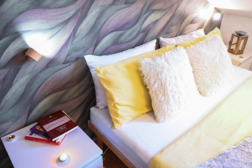Postel nebo postele na pokoji v ubytování A Casa di Lu' Elegant Rooms