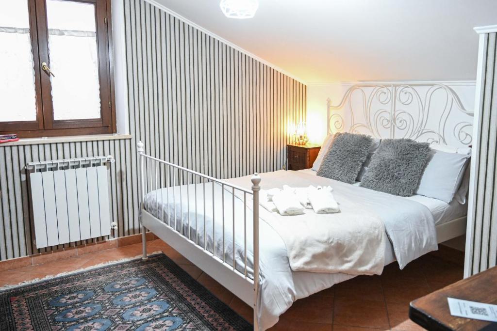 Postel nebo postele na pokoji v ubytování A Casa di Lu' Elegant Rooms