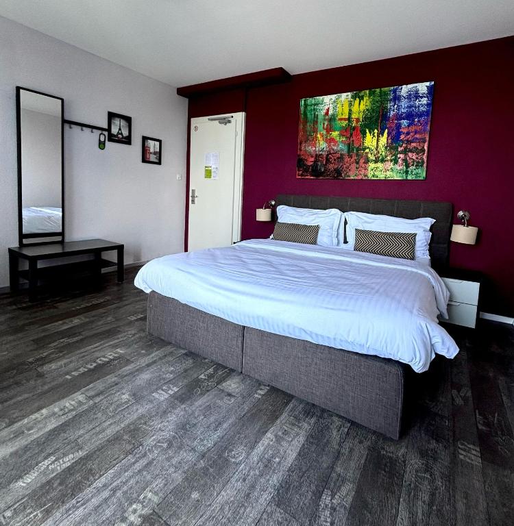 Uma cama ou camas num quarto em Hotel Parc & Lac