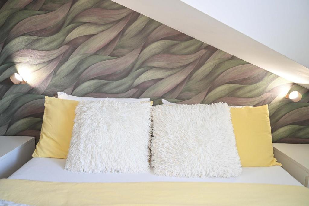 Postel nebo postele na pokoji v ubytování A Casa di Lu' Elegant Rooms