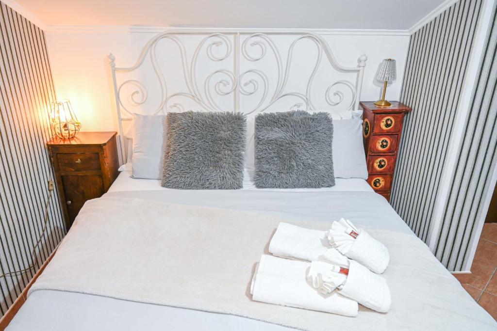 Postel nebo postele na pokoji v ubytování A Casa di Lu' Elegant Rooms