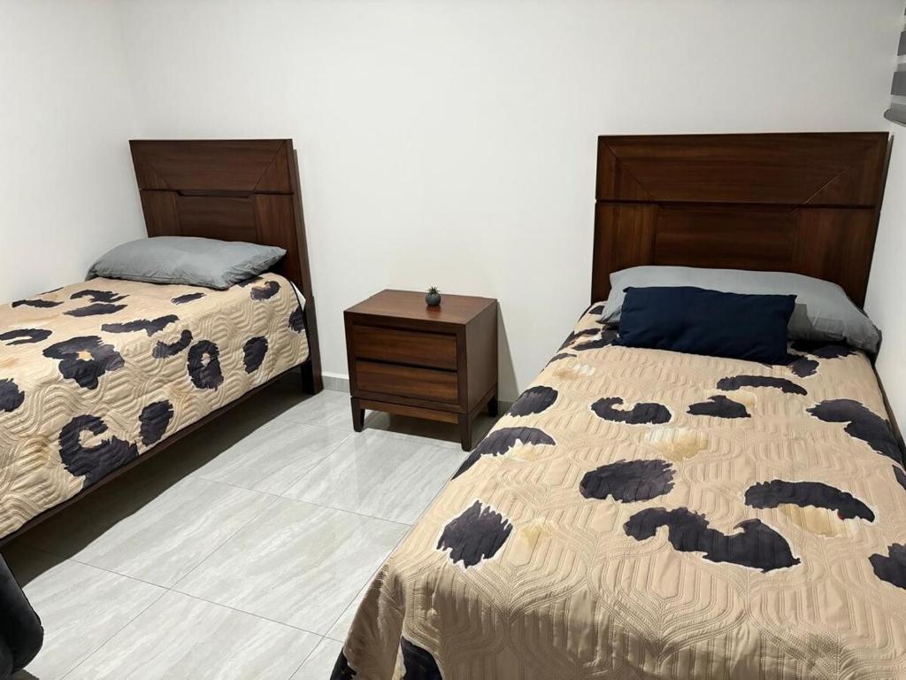 Postel nebo postele na pokoji v ubytování Mazatlán Vacation Apartment Marina Cerritos Condominios