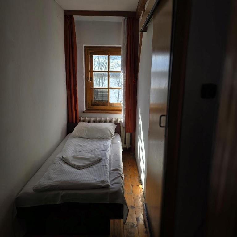 Postel nebo postele na pokoji v ubytování Zajazd Rybaki
