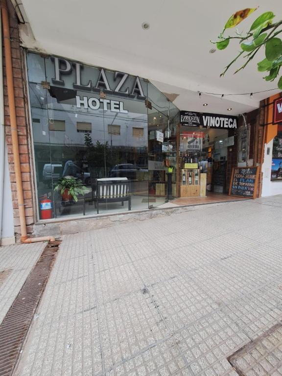an empty street in front of a hotel at plaza hotel in Termas de Río Hondo