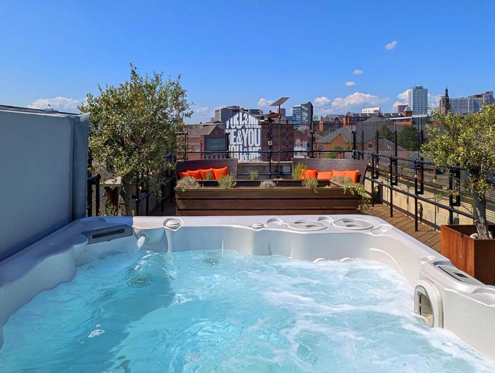 a hot tub on the roof of a building at The Bells - Luxury Serviced Apartments in Leeds