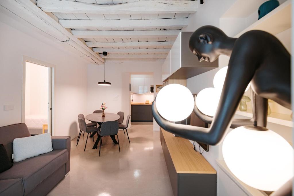 a living room with a couch and a table at Easy Flat 20 Settembre in Turin