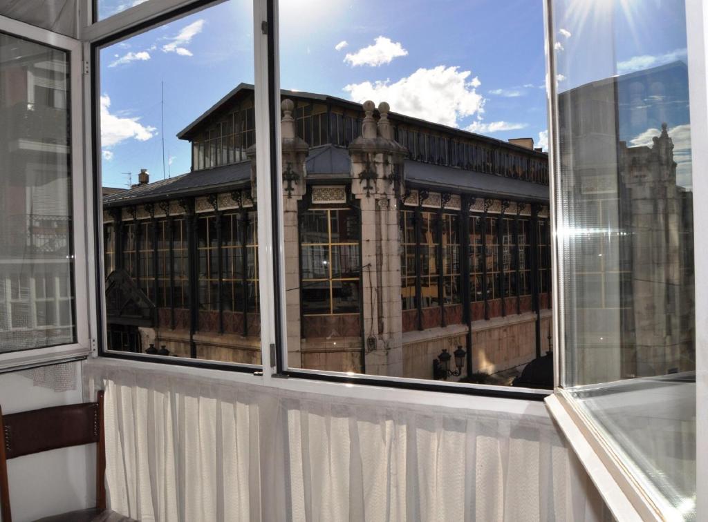 a view of a building from an office window at Hospedaje Botin in Santander