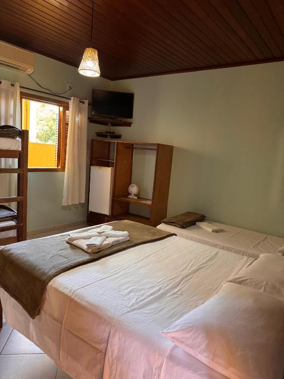 Postel nebo postele na pokoji v ubytování Pousada Cabeça do Indio - Trindade