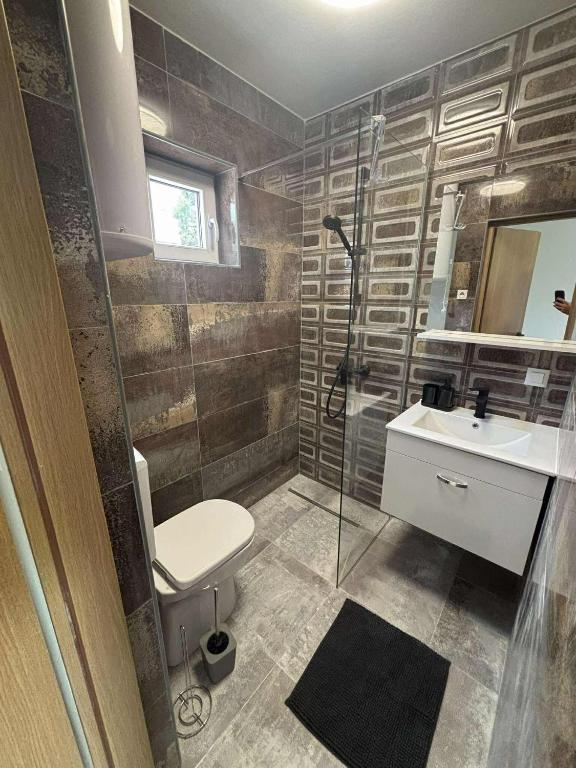 Koupelna v ubytování Soti Apartments