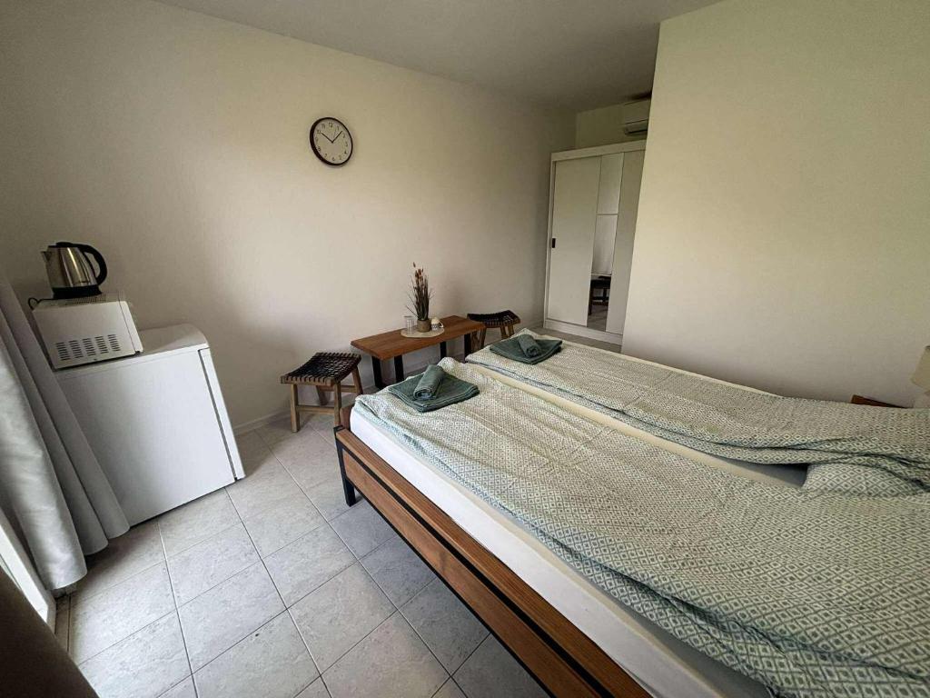 Postel nebo postele na pokoji v ubytování Soti Apartments