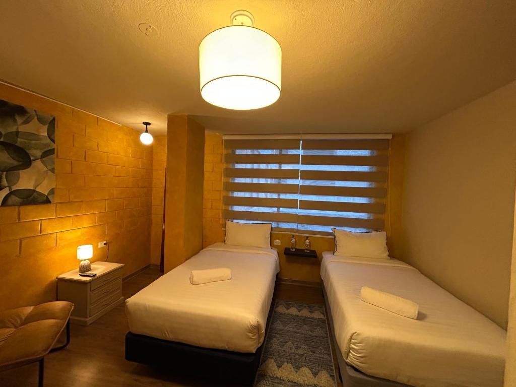 Postel nebo postele na pokoji v ubytování Hotel Casa Agave