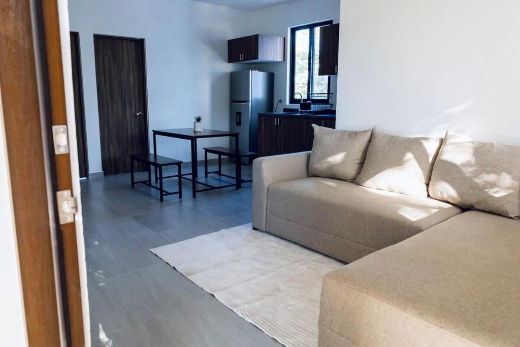 a living room with a couch and a table at Casa Ivanna Vallarta in Puerto Vallarta