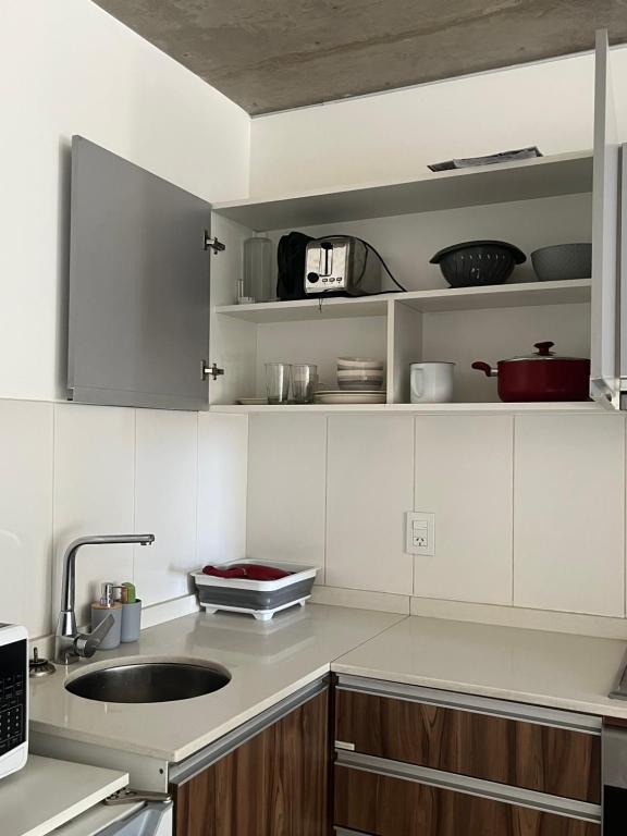 Küche/Küchenzeile in der Unterkunft Nuevo y moderno departamento a estrenar en el corazón de Fishertoon