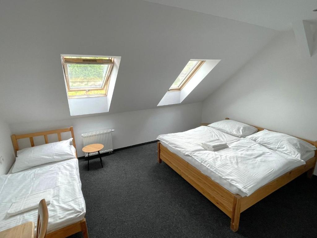 Postel nebo postele na pokoji v ubytování Hotel Joker
