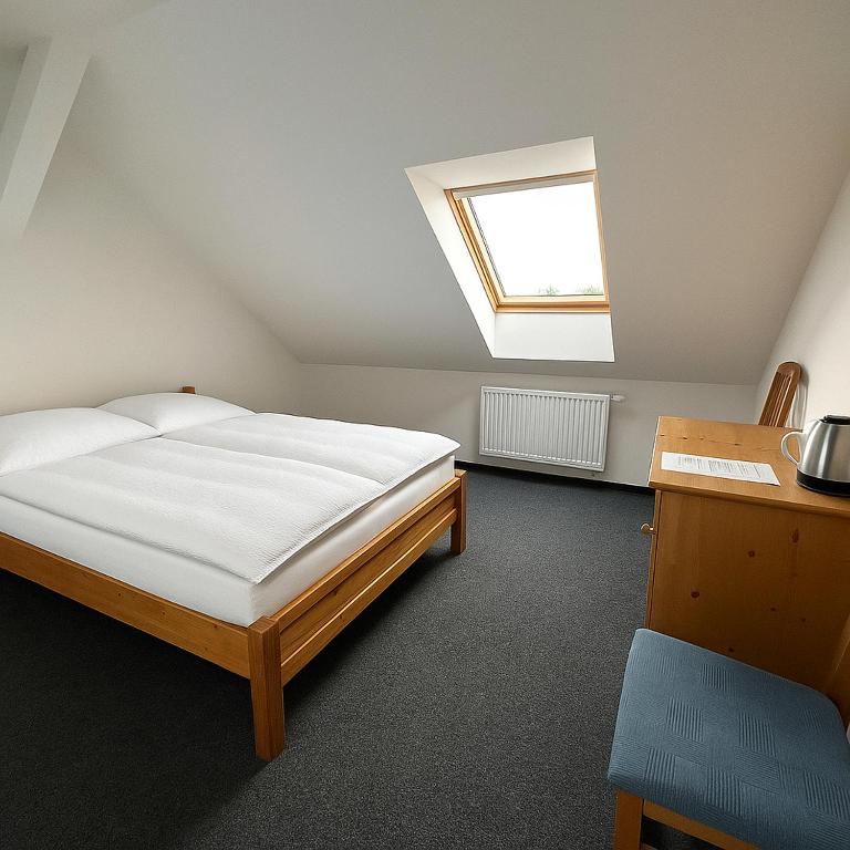 Postel nebo postele na pokoji v ubytování Hotel Joker