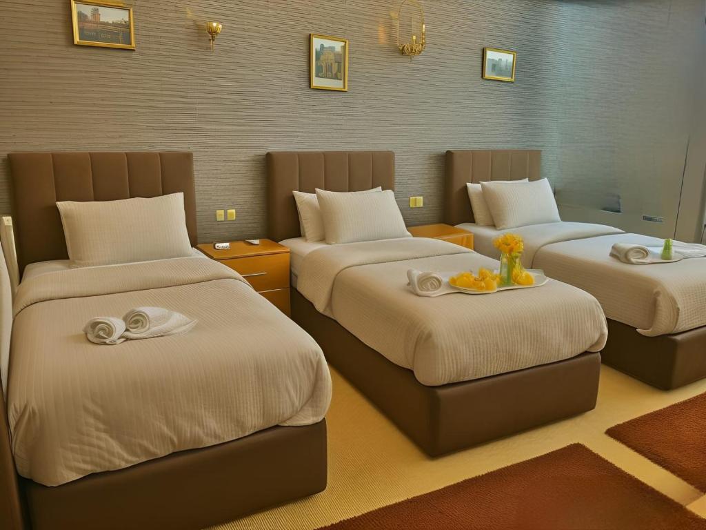 Postel nebo postele na pokoji v ubytování Arkan Egyptian Museum Hotel