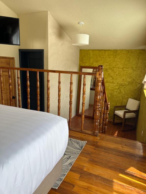 Postel nebo postele na pokoji v ubytování Hotel Casa Agave