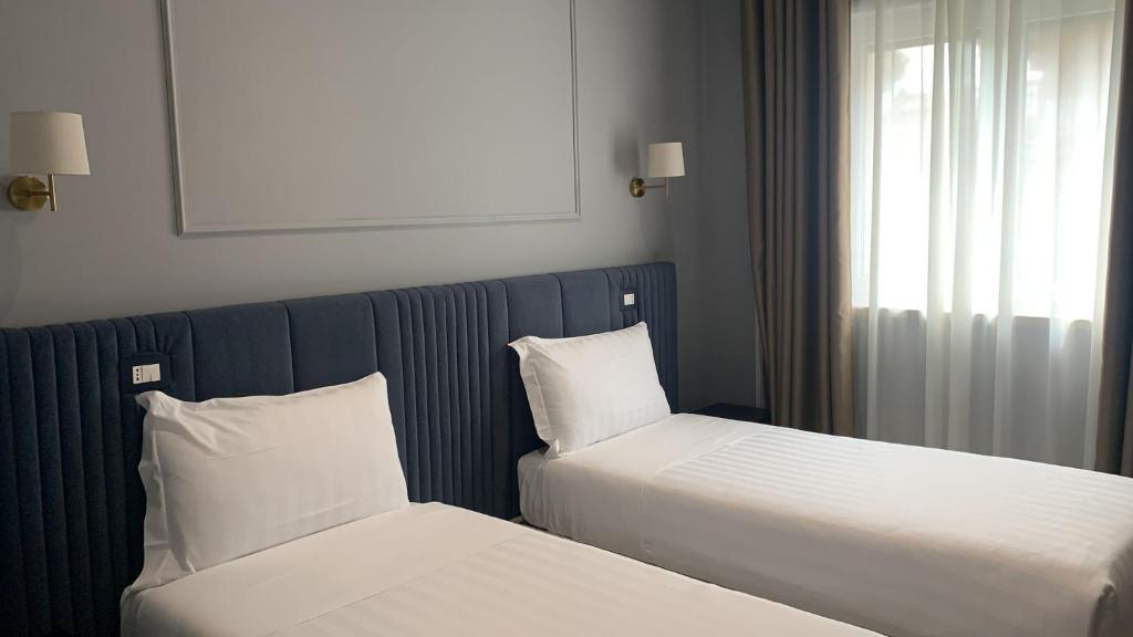 Posteľ alebo postele v izbe v ubytovaní Nouvelle Maison Rome Luxury Palace