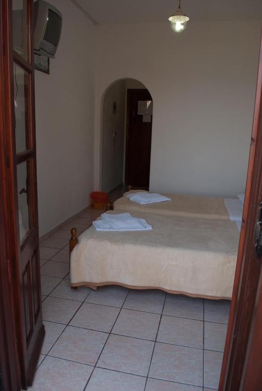 Postel nebo postele na pokoji v ubytování Asteri Hotel